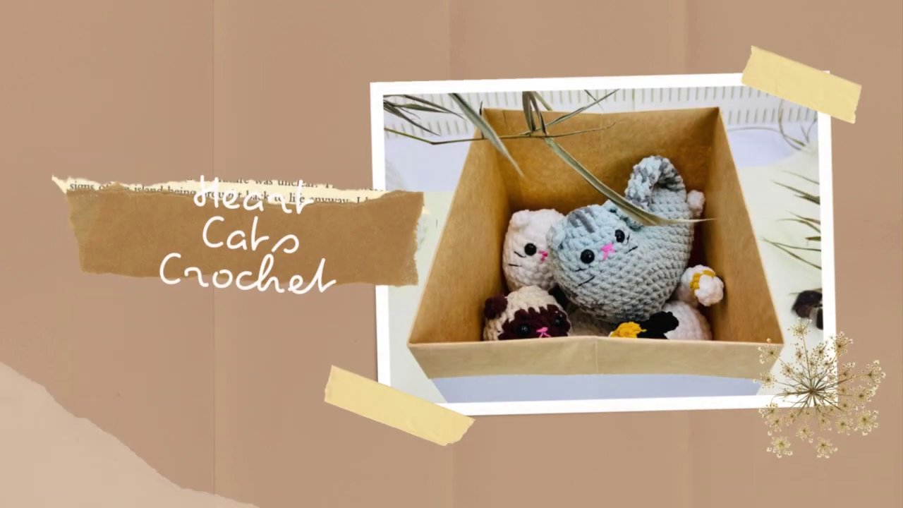 From Crochet Dinosaurs to Festive Surprises: A Visual Journey into Amigurumi Creativity 2 The opening title card features a charming crocheted yellow dinosaur with a white head, perched thoughtfully on a laptop keyboard against a rustic, floral background.