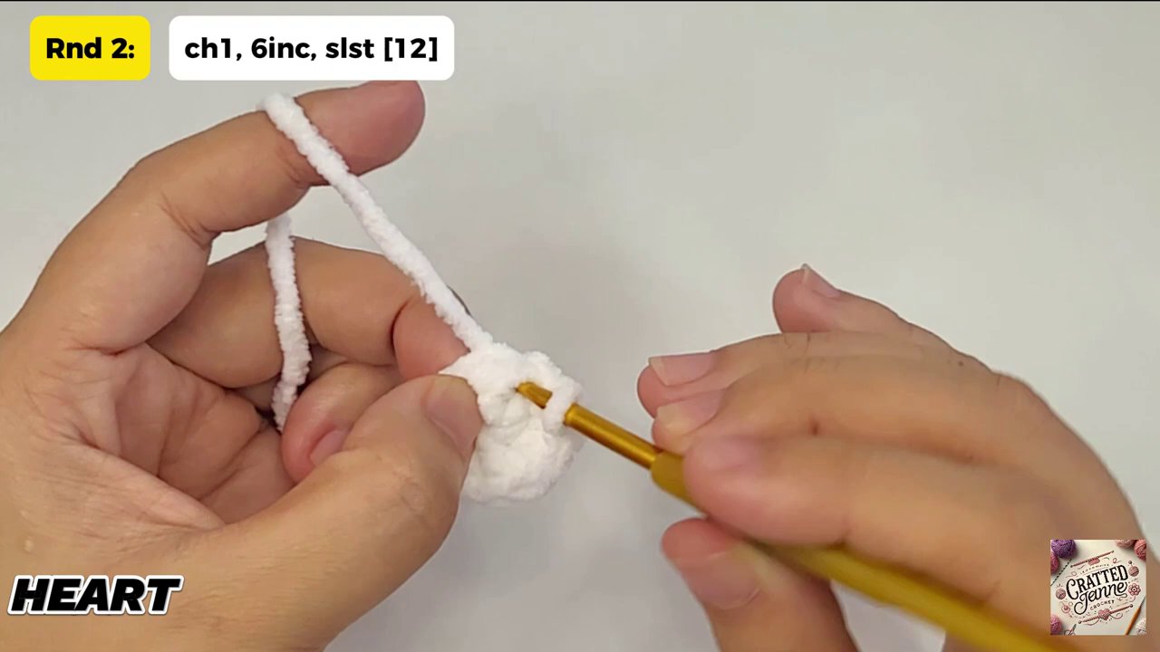 Craft a Heartwarming Christmas Gift: A Step-by-Step Guide to Crocheting a Heart Bear 5 The crafter using the long yarn tail to meticulously sew the two heart pieces together along their edges.