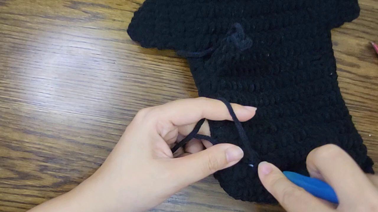 Crafting Comfort: A Step-by-Step Guide to Crocheting Your Own Bicycle Seat Post Cover 6 A side-angle view highlighting the cylindrical form taking shape on the table.