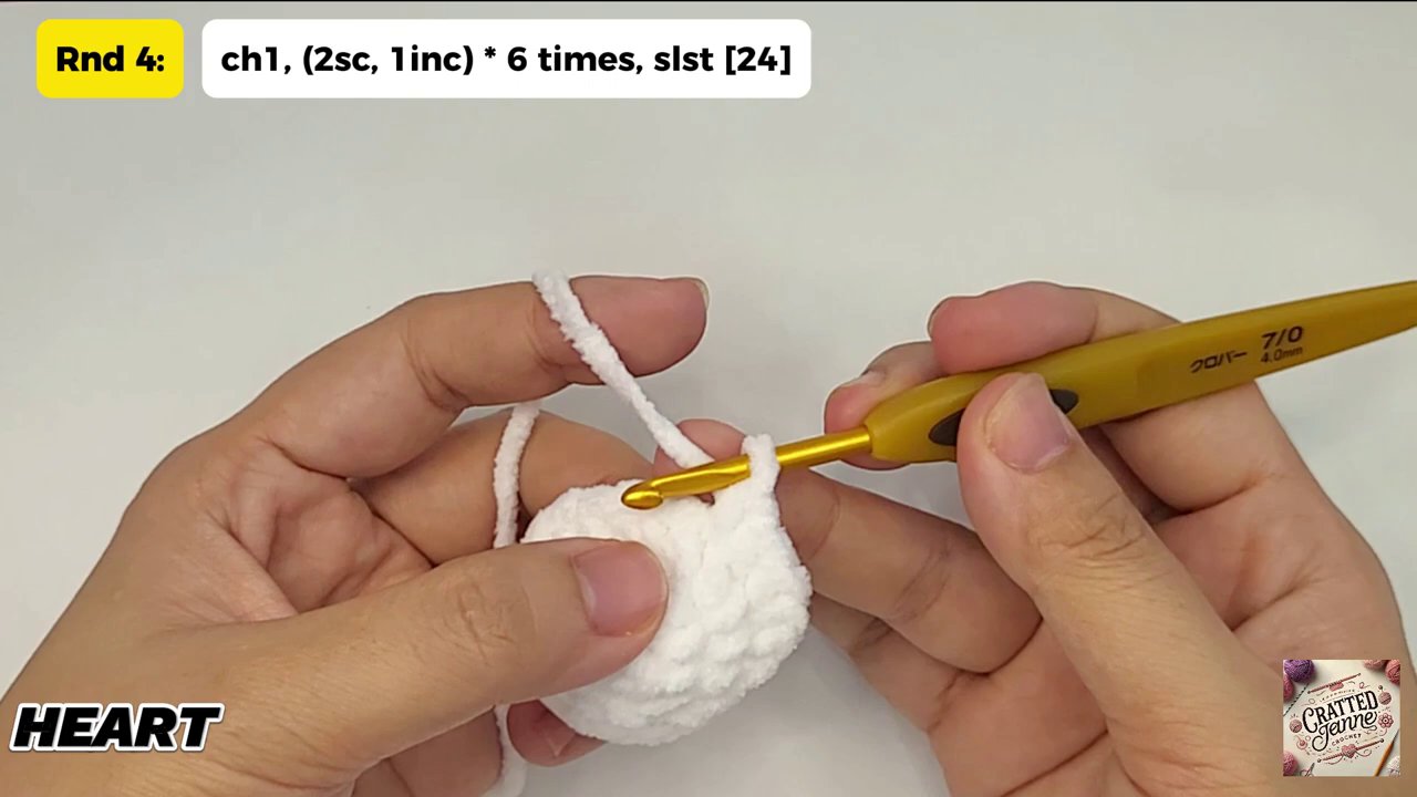 Craft a Heartwarming Christmas Gift: A Step-by-Step Guide to Crocheting a Heart Bear 7 A final stitch being pulled tight to close the gap, completing the plush, three-dimensional heart body.