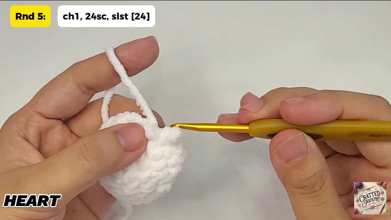 Craft a Heartwarming Christmas Gift: A Step-by-Step Guide to Crocheting a Heart Bear 8 A close-up shot of the gold hook creating the first few stitches of a tiny bear ear.