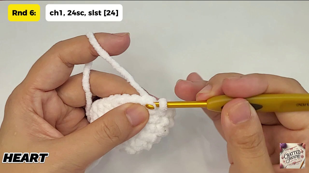 Craft a Heartwarming Christmas Gift: A Step-by-Step Guide to Crocheting a Heart Bear 9 The finished white heart bear with two small ears sewn in place, showcasing the final adorable form.