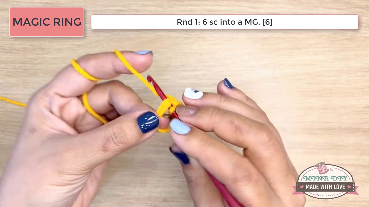 Mastering the Magic Ring and Beyond: A Beginner's Guide to Crochet Increases and Foundation Chains 5 The hands are positioned differently, holding the yarn and hook to begin a foundation chain, with the instruction box highlighting "WORKING ON A FOUNDATION CHAIN".