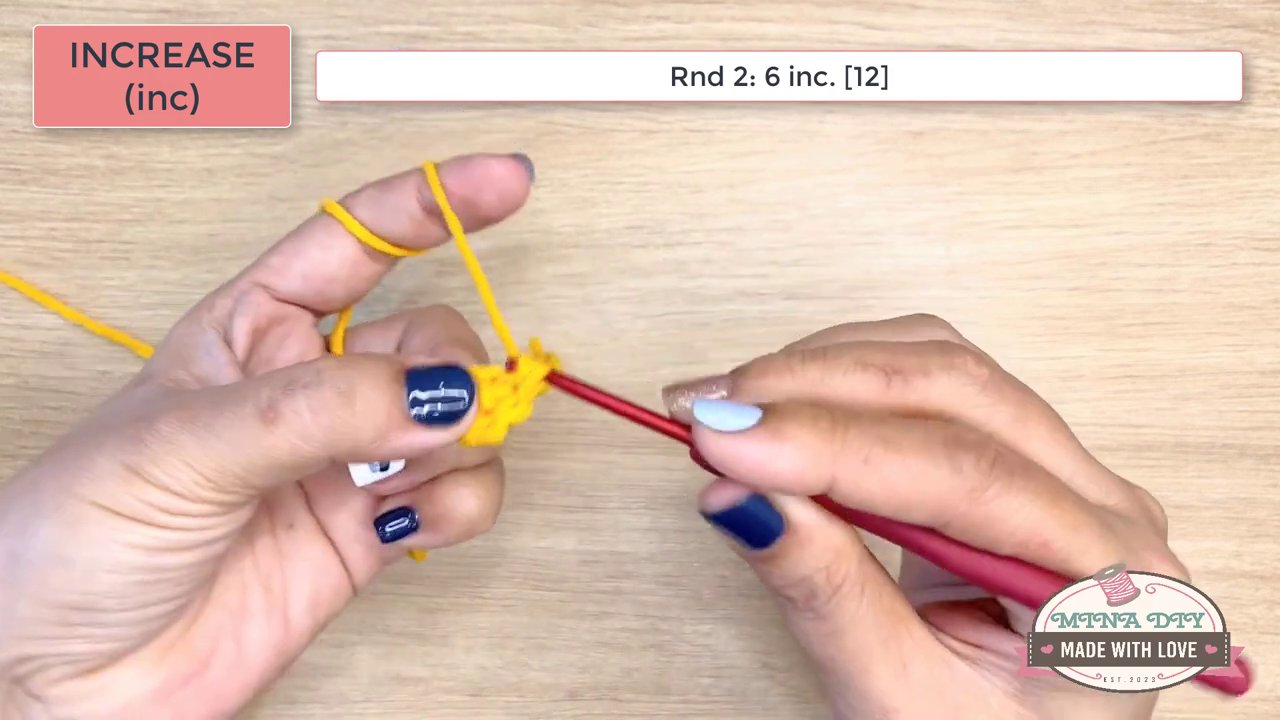 Mastering the Magic Ring and Beyond: A Beginner's Guide to Crochet Increases and Foundation Chains 7 The hands continue crocheting around the foundation chain, with the text box displaying the specific stitch counts for Round 1, highlighting the "3 sc into the last stitch" technique.